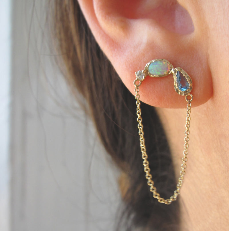 Ama Arch Mermaid Earrings made with Aquamarine, opal, blue topaz on Woman's Ear.