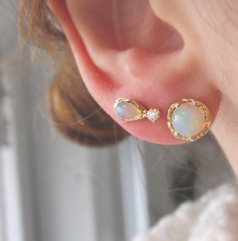 Two 14K Fire Coral Opal Earrings on Woman's Ear. 