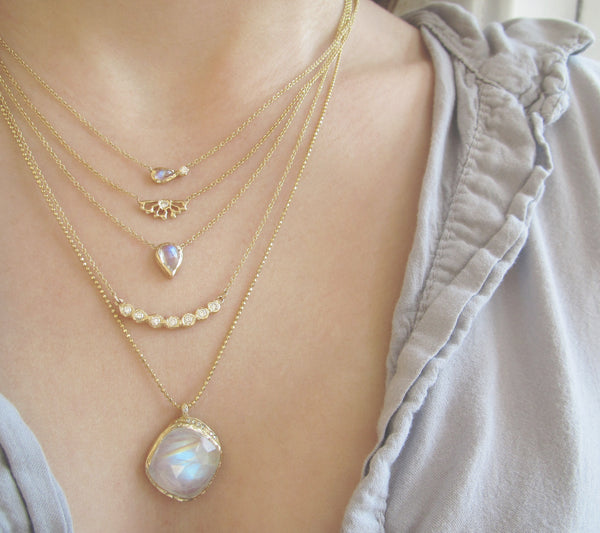 Moonstone Cove Necklace with White Round Brilliant Diamonds on Woman's Neck.
