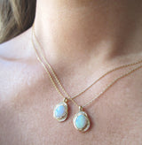 14K Yellow Gold Oasis Opal Necklace on Woman's Neck.