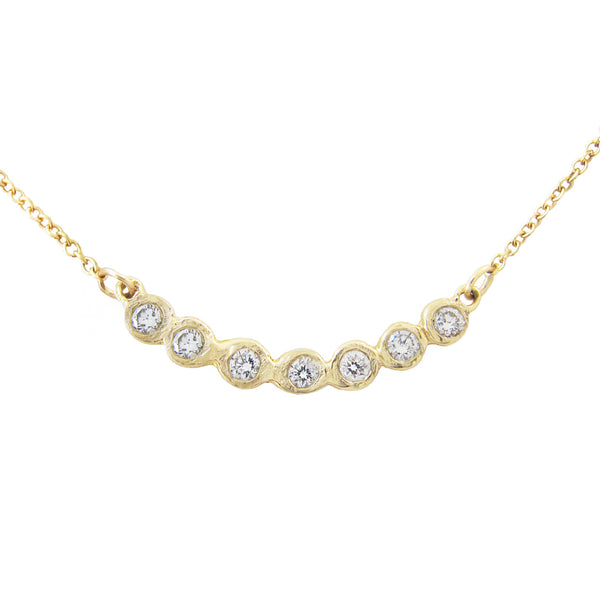 Tauri Diamond Necklace made with seven white round brilliant diamonds.