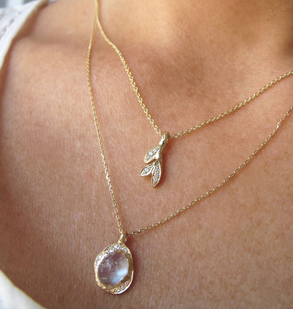 Oasis Moonstone Necklace with White Round Brilliant Diamonds on Woman's Neck.