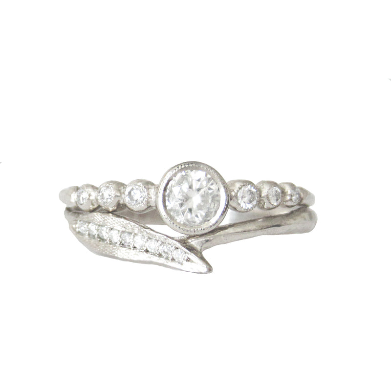 14K White gold ring with White round brilliant diamonds.