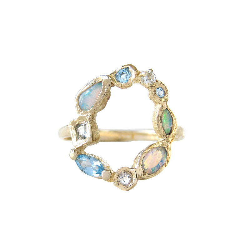 Ama harbor mermaid ring made with opal, blue topaz and aquamarine.