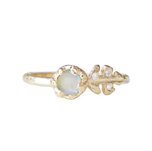 Floret opal ring with three white round brilliant accent diamonds.