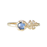 Floret blue sapphire ring three white round brilliant accent diamonds.