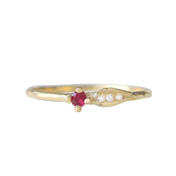 Sprout ruby ring three white round brilliant accent diamonds.