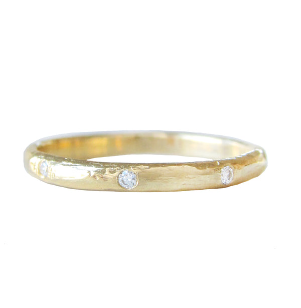 Vega diamond ring with eight white round brilliant diamonds.