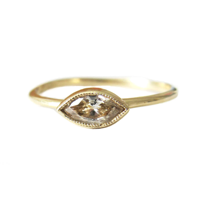 Yellow gold ring with champagne diamond.