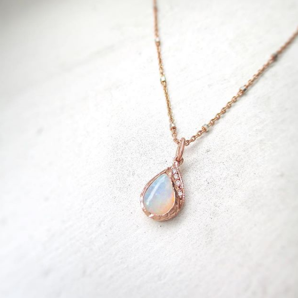 Raindrop Opal Necklace hanging. 