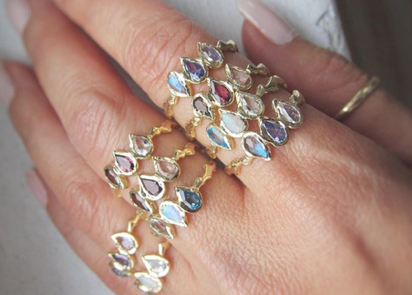 9 Mermaid collection rings on woman's hand.