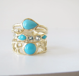3 Turquoise and blue topaz gold rings.