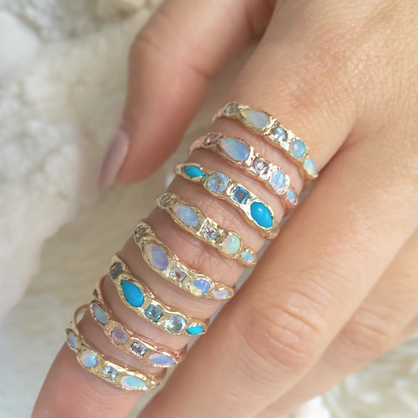8 Turquoise and blue topaz gold rings.