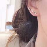 14K Gold Twig Ear Pin on woman's ear.