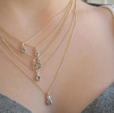 Six Twin Star Necklace with Grey Round Brilliant Diamonds on Woman's Neck.
